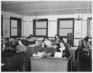 The Student Relocation Council offices on the 15th floor at 1201 Chestnut Street, Philadelphia, are the mecca for all Japanese Americans arriving here. From left to right they are Kimi Tanaka, Poston; Chiyo, Hiraoka, Gila River; Mrs. Iyo Tamaki, Central Utah; and Kay Yamashita, Central Utah. 